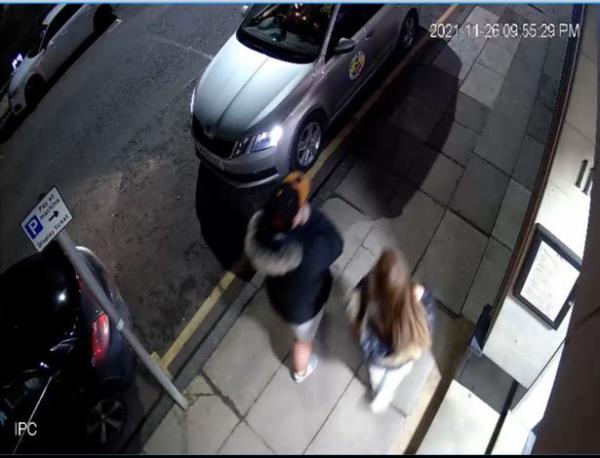 Gibson and his sister Amber Gibson walking on a street in Hamilton, South Lanarkshire at 9.55pm on November 26